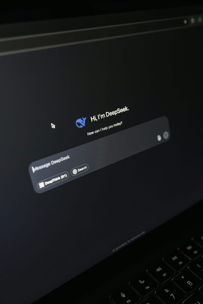 Close-up of a laptop screen displaying an AI chatbot interface with a dark theme.